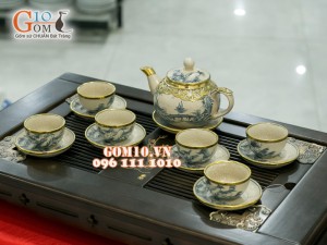 Bộ ấm chén dáng quả hồng men rạn cổ bọc đồng