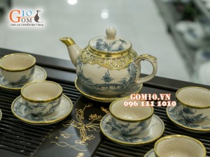 Bộ ấm chén dáng quả hồng men rạn cổ bọc đồng