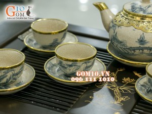 Bộ ấm chén dáng quả hồng men rạn cổ bọc đồng