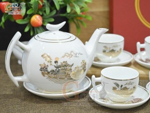 Bộ ấm chén dáng bưởi cành men trắng họa tiết Chùa Một Cột vàng kim, 600ml