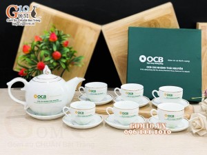 Bộ ấm chén dáng chóp lửa men trắng kẻ chỉ vàng kim - in logo