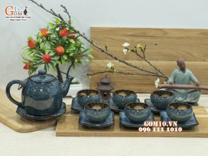 Bộ ấm chén dáng dưa men hỏa biến chén lòng hoa