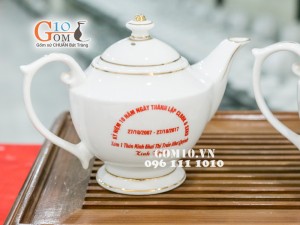 Bộ ấm chén dáng hoàng cung men trắng kẻ chỉ vàng - in logo