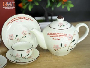 Bộ ấm chén dáng quả hồng men kem vẽ hoa Đào phai inlogo