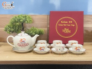 Bộ ấm chén dáng quả hồng men kem vẽ hoa Đào phai inlogo