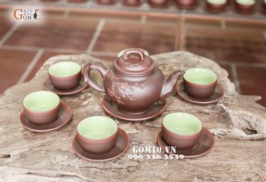 Bộ ấm chén men gốm dáng Báo xuân cao, đắp hoa đào