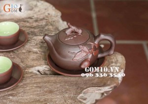 Bộ ấm chén men gốm dáng Trường Thọ, đắp đào