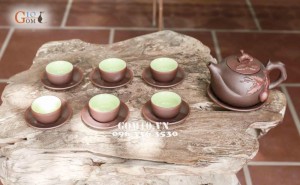 Bộ ấm chén men gốm dáng Trường Thọ, đắp đào
