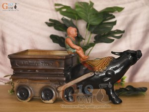 Chậu tượng chú tiểu cưỡi trâu kéo xe Tài Lộc, dài 44cm
