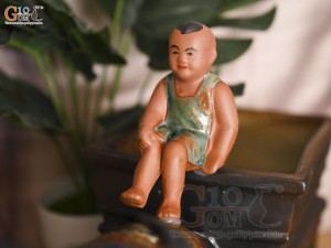 Chậu tượng chú tiểu cưỡi trâu kéo xe Tài Lộc, dài 44cm