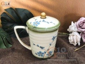 Cốc men vuốt dáng vát, vẽ hoa đào xanh, đường kính 9cm