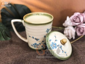 Cốc men vuốt dáng vát, vẽ hoa đào xanh, đường kính 9cm