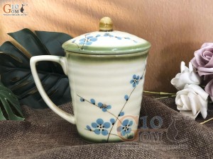 Cốc men vuốt dáng vát, vẽ hoa đào xanh, đường kính 9cm