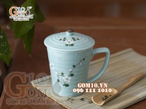 Cốc sứ có nắp men ngọc thanh dương vẽ hoa Đào trắng