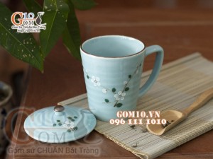 Cốc sứ có nắp men ngọc thanh dương vẽ hoa Đào trắng