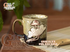 Cốc sứ men hoả biến gấm vàng khắc sen , đường kính 8cm