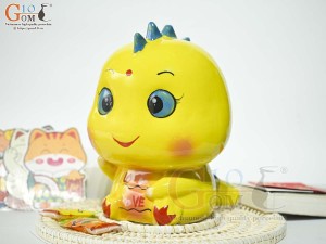 Khủng Long sứ tiết kiệm màu vàng, cao 23cm