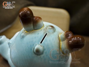 Tiểu Long tiết kiệm dáng nằm ôm vàng màu xanh, dài 25cm