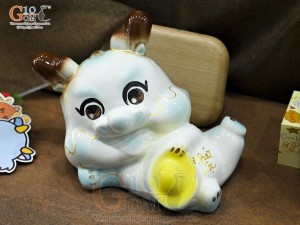 Tiểu Long tiết kiệm dáng nằm ôm vàng màu xanh, dài 30cm