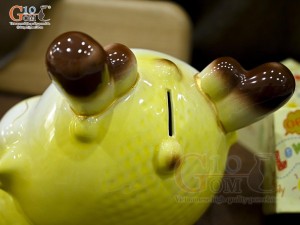 Tiểu Long tiết kiệm dáng nằm ôm vàng, dài 25cm