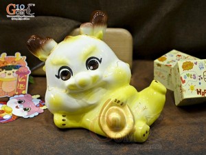 Tiểu Long tiết kiệm dáng nằm ôm vàng, dài 30cm