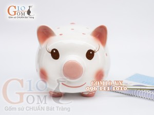Heo sứ tiết kiệm màu trắng chấm bi hồng dài 21cm