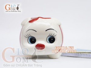 Heo sứ tiết kiệm màu trắng họa tiết nơ đỏ dài 19cm