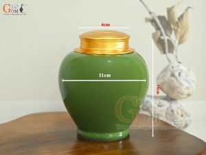 Lọ chè dáng tròn họa tiết hoa Sen vàng kim, nền xanh lá, 250g