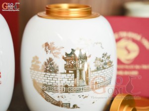 Lọ chè men trắng nắp kim loại dáng bom, họa tiết Khuê Văn Các in logo