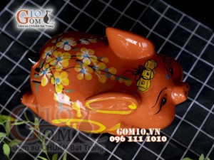 Heo sứ tiết kiệm dáng bay nền cam, 26x16 H16cm
