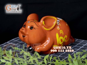 Heo sứ tiết kiệm dáng bay nền cam, 26x16 H16cm