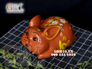 Heo sứ tiết kiệm dáng bay nền cam, 26x16 H16cm