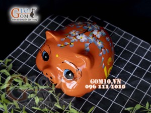 Heo sứ tiết kiệm dáng béo nền cam, 23x19 H18cm