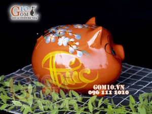 Heo sứ tiết kiệm dáng béo nền cam, 23x19 H18cm