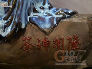 Tượng gốm thần trà men hỏa biến xanh đá, rộng 41cm