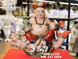Tượng sứ Di Lạc cưỡi cá chép hóa rồng men đỏ 43cm