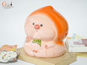 Tượng sứ tiết kiệm dáng trái đào màu cam, cao 20cm