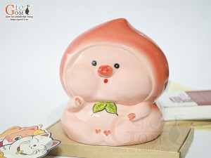 Tượng sứ tiết kiệm dáng trái đào màu đỏ, cao 20cm