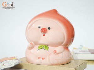 Tượng sứ tiết kiệm dáng trái đào màu đỏ, cao 17cm