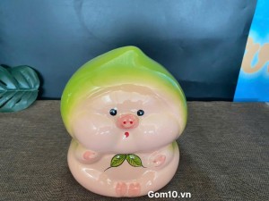 Tượng sứ tiết kiệm dáng trái đào màu xanh, cao 17cm