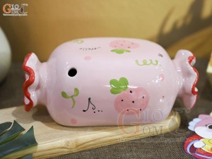 Tượng sứ tiết kiệm kẹo candy màu hồng, dài 21cm
