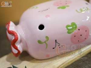 Tượng sứ tiết kiệm kẹo candy màu hồng, dài 21cm