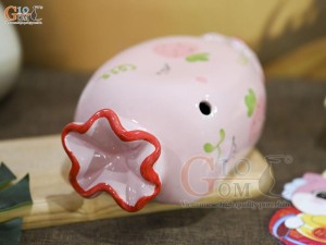 Tượng sứ tiết kiệm kẹo candy màu hồng, dài 21cm