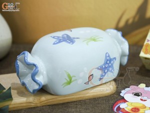Tượng sứ tiết kiệm kẹo candy màu xanh, dài 21cm